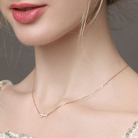 18K Rose Gold Sideways Cross Necklace with Diamonds