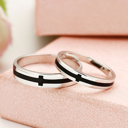 His and Hers Black Onyx Cross Wedding Bands in Sterling Silver
